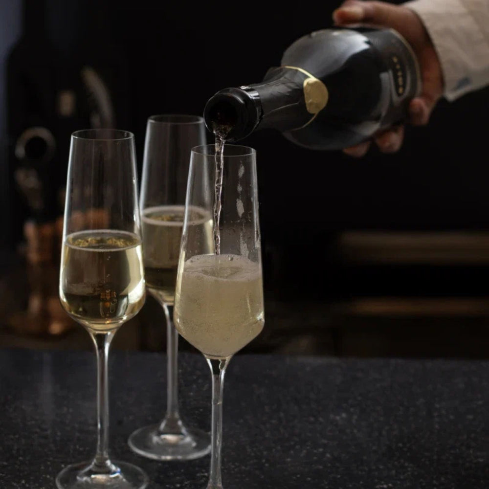 A bottle of Bölle Grand Reserve sparkling wine, featuring a dark glass bottle with a gold seal and gold lettering on the label, set against a plain white background.