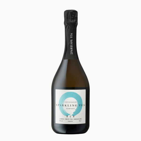 A bottle of Sparkling Tea by Copenhagen Tea Company, featuring a dark glass bottle with a black foil capsule and a white label with a light blue circular design.