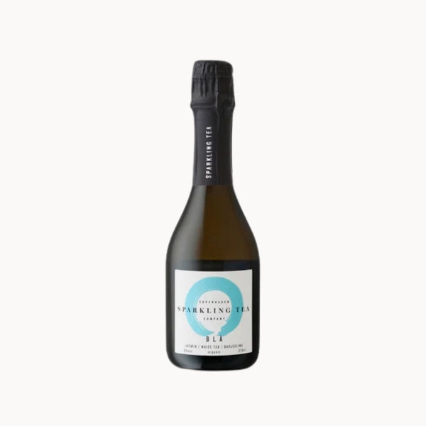 Half bottle of sparkling tea on a white background