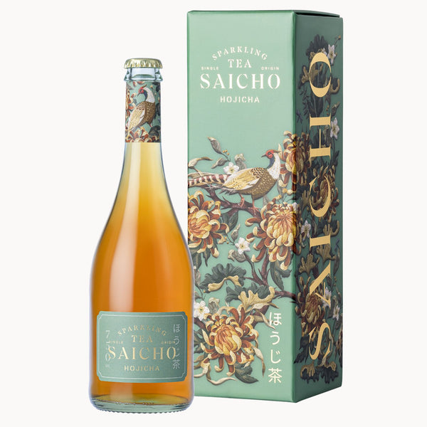 A bottle of Saicho Hojicha sparkling tea with amber-colored liquid, a decorative neck label, and a matching illustrated green box standing beside it on a light gray background.