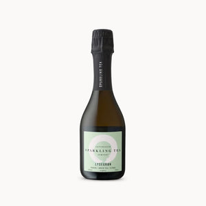 A bottle of Lysegrøm Sparkling Tea by Evergreen Tea Company, featuring a dark glass bottle with a black foil capsule and a pale green label, set against a plain white background.