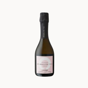 A bottle of Lyserod sparkling tea, featuring a dark glass bottle with a pale pink label and a black foil capsule, set against a plain white background.