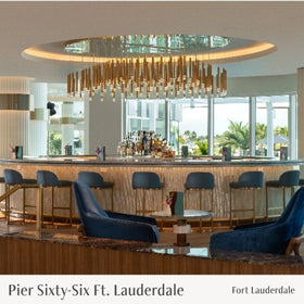 Modern bar interior with a chandelier and blue chairs, labeled 'Pier Sixty-Six Ft. Lauderdale'.