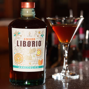 Bottle of Amaro Liborio with a cocktail in the background