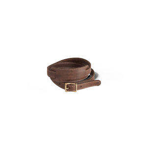 Brown leather belt with a gold buckle on a white background