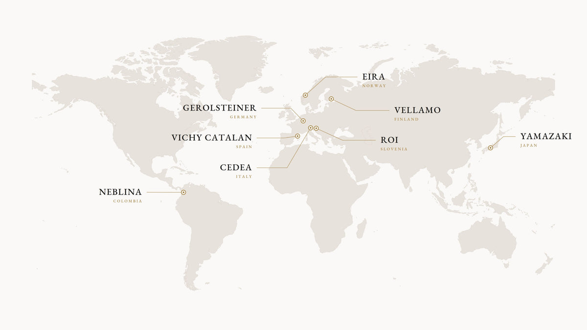 A minimalist world map graphic in light beige and taupe, with labeled vineyard or winery locations including Eira, Gerolsteiner, Vichy Catalan, Cedeau, Neblina, Roy, Vellamo, and Yamazaki.