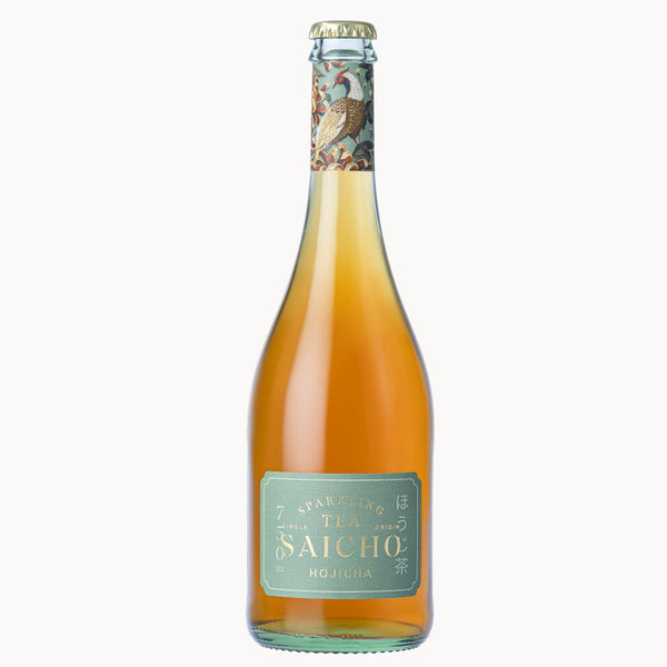 A bottle of Saicho Japanese Hojicha  Sparkling Tea with a light green label and a decorative cap, filled with amber-colored tea, on a solid white background.