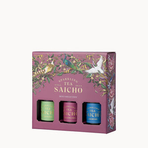 A boxed tea gift set on a plain white background. The packaging is dusty mauve with gold lettering reading 'Sparking Tea Saicho' and ornate botanical illustrations.