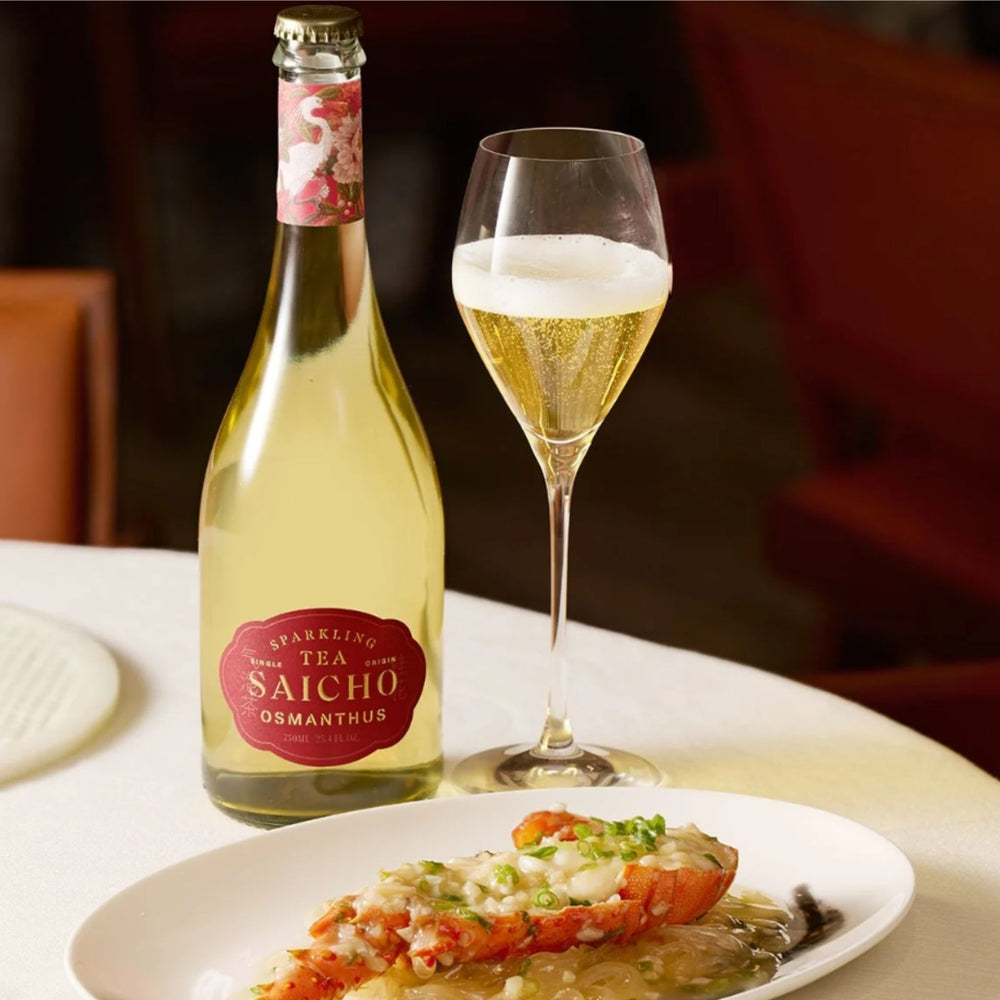 Bottle of Saicho sparkling tea with floral design and packaging