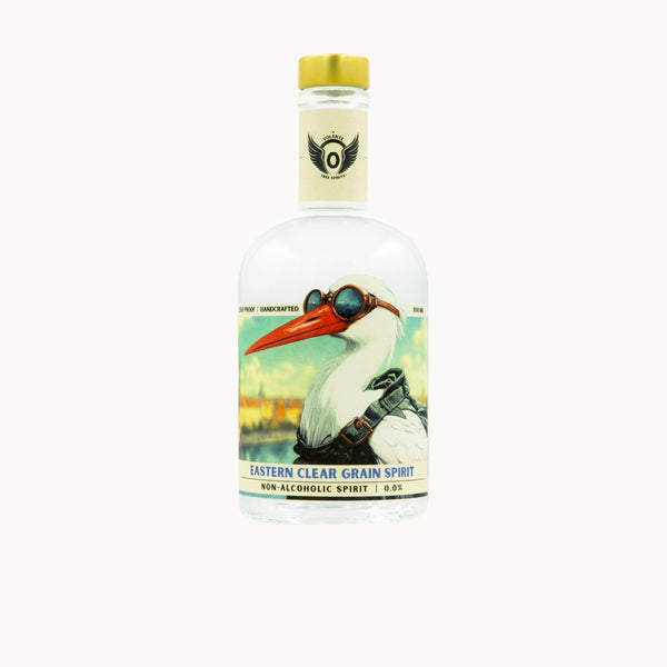 A clear glass bottle of Eastern Clear Grain Spirit non-alcoholic spirit, featuring a vintage-style label with an illustration of a white bird wearing goggles and a yellow cap, on a light gray background.