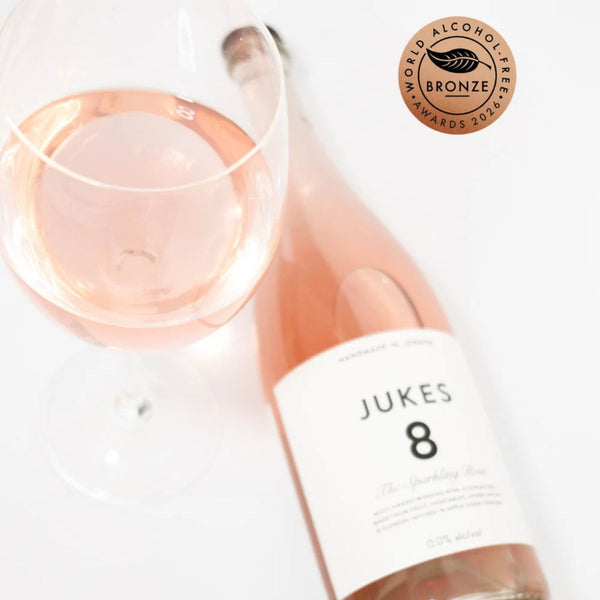 JUKES 8 The Sparkling Rosé at RIENNE poured into a wine glass, World Alcohol-Free Awards 2026 Bronze winner